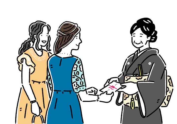 お礼を渡しているところ