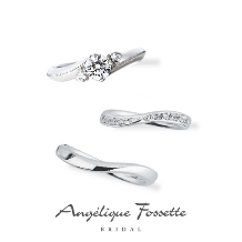 アンジェリック　フォセッテ　ブライダル:贅沢にあしらわれたダイヤモンドの輝きとエッジの効いたラインがもたらす光沢感が豪華