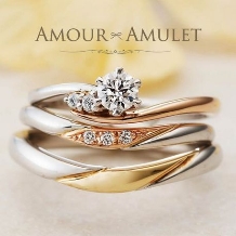 【プラチナとゴールドのコンビリング】優しい曲線にダイヤが輝く