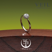 ＶＥＩＬ（ヴェール）:倖せを運ぶたんぽぽのデザインが可愛い婚約指輪【萬時】